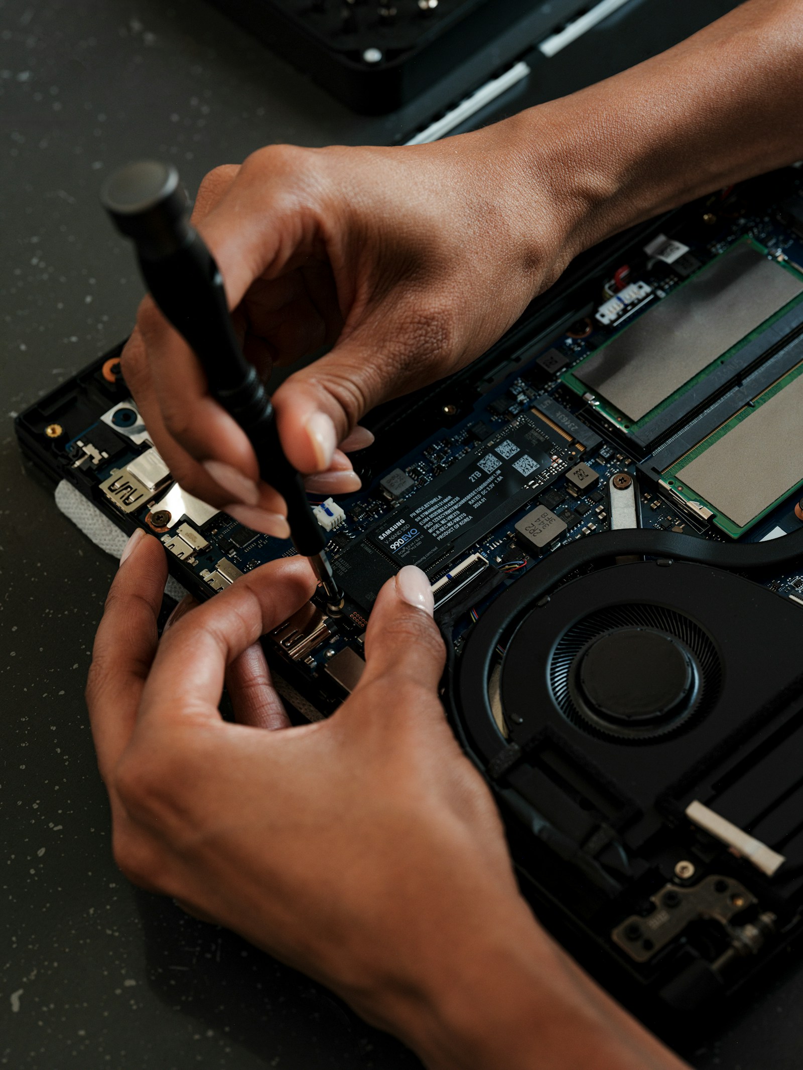 MacBook repair bench — SSD upgrade and diagnostics at Dr. Chip